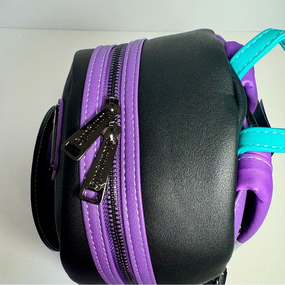 NWT. Loungefly Disney\'s The Haunted Mansion Madame Leota Mini Backpack glows main image 11